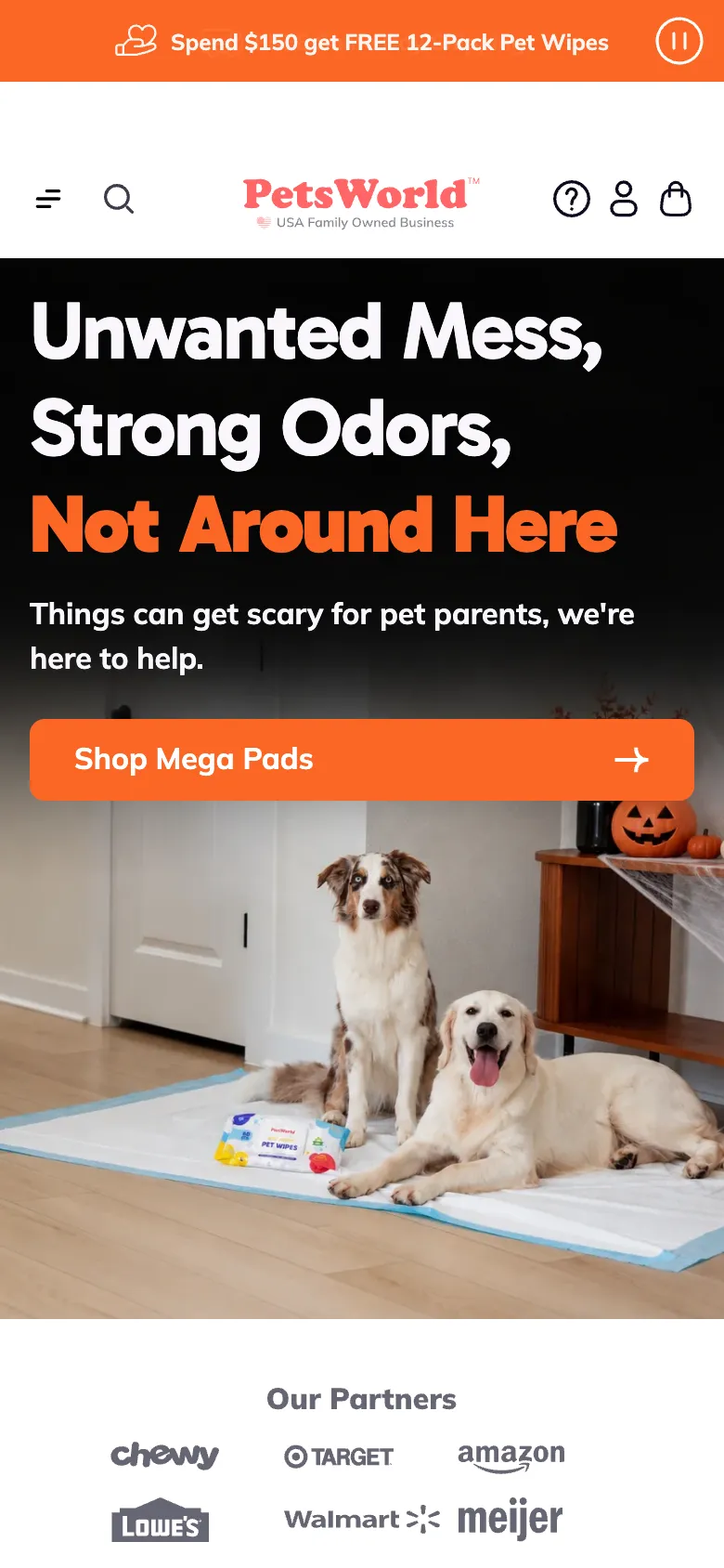 The homepage on a phone: the same headline over the photo of the two dogs, and Shop Mega Pads