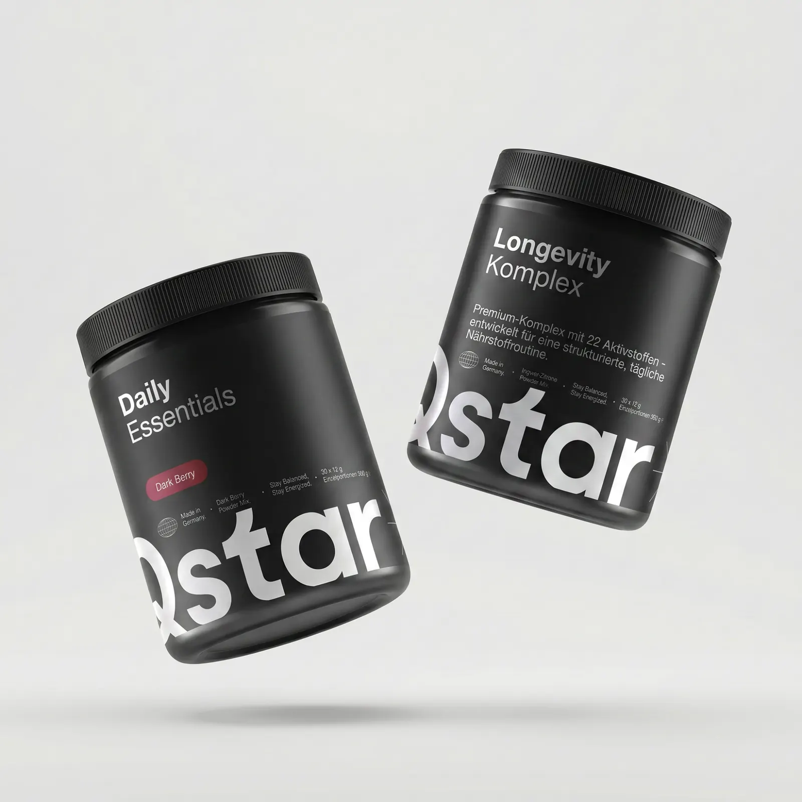 Two Qstar jars, Daily Essentials and Longevity Komplex, floating against a pale grey background